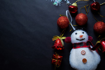 Fototapeta premium Decorative Christmas and snowman isolated on black background