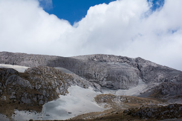 the mist melting with the ash-covered mountain in the nevados park of colombia
