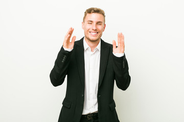 Young caucasian business man joyful laughing a lot. Happiness concept.
