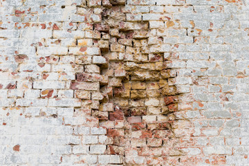 Fragment of a brick wall of an old building