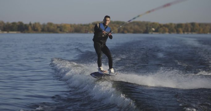 Wakeboarder falling in water