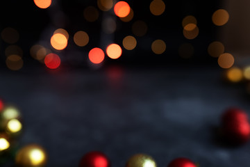 Abstract bokeh texture Christmas lights on a dark background. Sparkling lights product background. Bokeh background of garland lights.