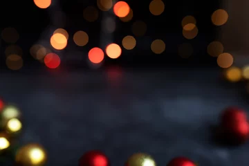 Abstract bokeh texture Christmas lights on a dark background. Sparkling lights product background. Bokeh background of garland lights. © Anna Ria