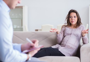 Pregnant woman visiting psychologist doctor