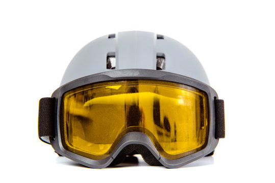 Ski helmet ski goggles isolated on white background. The concept of skiing, proper clothing and preparation for winter sports.