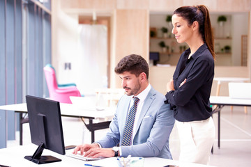 Group of business people brainstorming together in the office