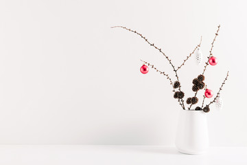 Winter composition, decoration, cones, branches in vase on white background. Christmas, New Year,...