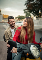 happy man and woman on a motorcycle. lifestyle concept