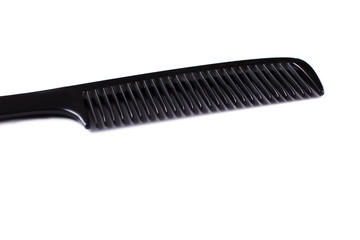 Black hair comb and copy space. Plastic hair brush isolated on white background.