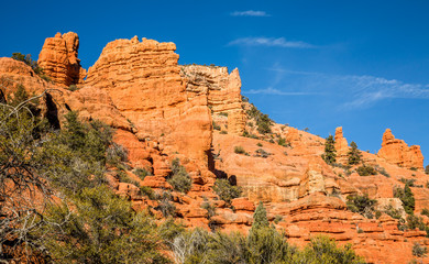 Towering cliffs of red sandstone in Southern Utah desert near Bryce Canyon National Park.