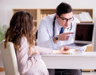 Pregnant woman visiting doctor for consultation