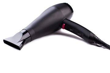 Black hair dryer on white background. Electric hair dryer. Space for text.