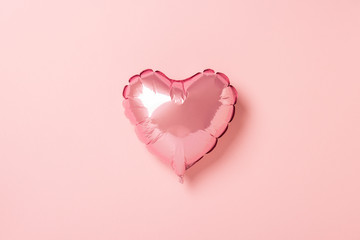 Pink air balloon heart shape on a pink background. Wedding concept, Valentine's Day, a gift for a loved one. Banner. Flat lay, top view