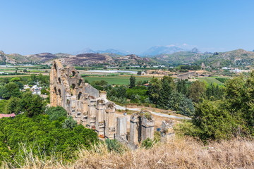 Fototapeta na wymiar Aspendos or Aspendus, an ancient Greco-Roman city in Antalya province of Turkey. The Roman aqueduct