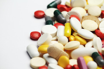 Different colorful tablets at white background