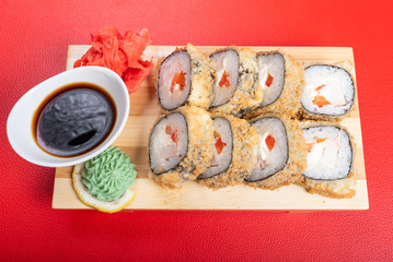 Baked roll breaded. with various fillings. With ginger and wasabi.