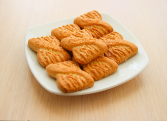 The photo of a pile of  cookies or shortcake biscuits on the plate. National Cookie Day background