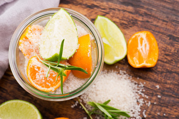 Preserved Lime and Mandarin with salt on a wooden board