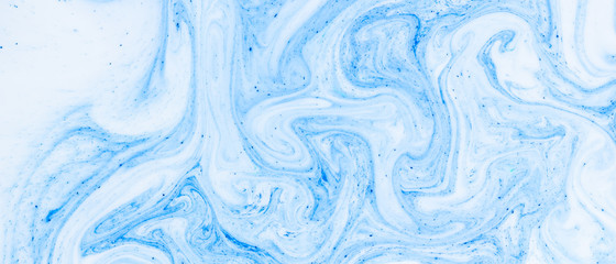 Fluid Art with white blue color. Abstract multicolored background. Blue white texture. Colored paint stains in liquid. Marble art. Fantastic iridescent colors