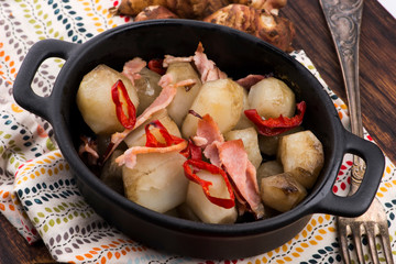 Jerusalem artichoke au gratin with ham and chili. Fricassee, fruits