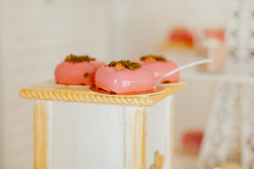 Desserts with fruits, mousse, biscuits. Different types of sweet pastries, small colorful sweet cakes, macaron, and other desserts in the sweet buffet. candy bar for birthday.