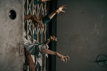 Zombie hands sticking out of the elevator, horror - obrazy, fototapety, plakaty