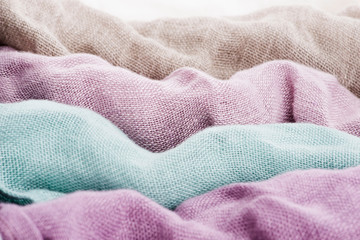 Multicolored textile with violet tones and colorful accents and rich, detailed texture, flax