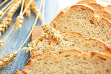 Sliced fresh bread on table, closeup
