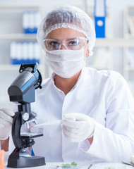 Female scientist researcher conducting an experiment in a labora