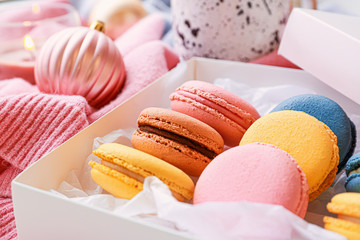 Different tasty macarons on table, closeup