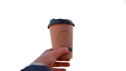 Girl holds a paper cup with coffee in hand on a white background