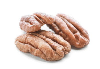 Tasty pecan nuts on white background