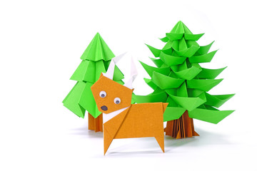 Obraz na płótnie Canvas Origami paper art : Santa Claus's reindeer and Christmas tree for greeting season of Christmas and New year. Copy space