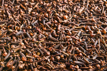 Aromatic cloves as background, closeup