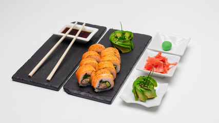 Images of an exquisite selection of sushi rolls of varied flavors and textures made in Concepcion, Chile.