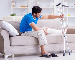 Injured young man recovering at home