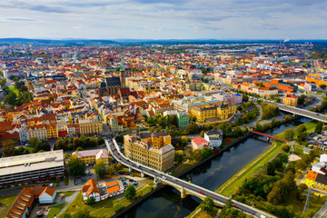 Fototapeta na wymiar Picturesque aerial view of old buildings of Pilsen cityscape with river and ponds, Czech Republic