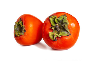 Ripe and sweet persimmon, orange color, on white