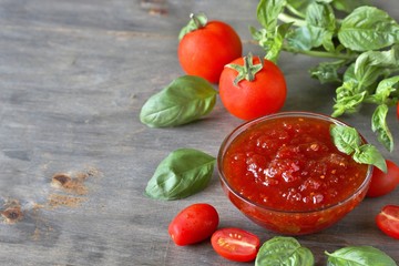 tomato jam. Jam from tomatoes with basil. Soft focus. Place for text. Copy Space.