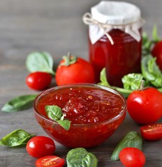 tomato jam. Jam from tomatoes with basil. Soft focus. Place for text. Copy Space.