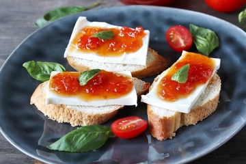 sandwich with cheese and jam from tomatoes with basil. tomato jam. Turkish, French or Italian cuisine. 