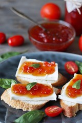 sandwich with cheese and jam from tomatoes with basil. tomato jam. Turkish, French or Italian cuisine. 