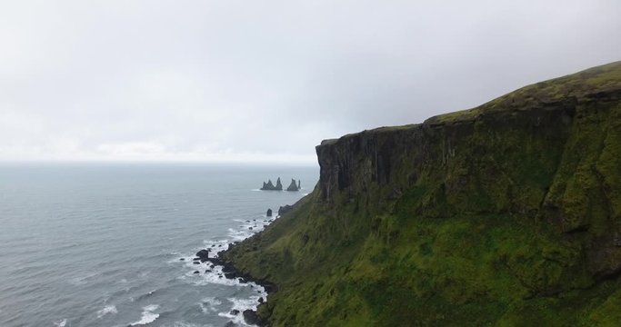 Drone view of the cliffs Troll's Fingers from Vikurfjara Black Sand Beach near Vik in Iceland