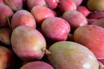 red stacks of mango fruits