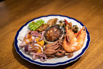eat plate of seafood on table