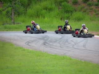 Kart race. Riders driving Kart