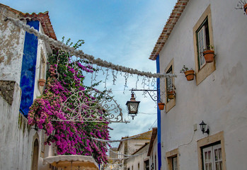 Obidos/Portugal - building of the old city are decorated for Christmas.