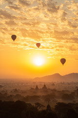 Group of the hot air balloons flying over ancient pagoda in Bagan plain at dawn. Bagan now is the UNESCO world heritage site and the first kingdom of Myanmar. 