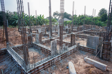 Fototapeta premium Landscape of house under construction site with reinforcement steelwork