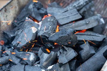 Close up of coal with fire burning in winter season.